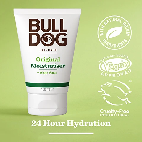 Image 2 - A white tube of Bulldog Skincare Original Moisturiser with Aloe Vera stands against a light green background, featuring labels indicating it is vegan, cruelty-free, and made with natural origin ingredients, along with text stating 24 Hour Hydration.
Image 3 - Image of a green aloe vera leaf with a droplet of gel, featuring text that reads 96% Natural Origin, Unlock the true potential of natural origin ingredients, Aloe Vera.
Image 4 - A hand is holding a tube of Bulldog Skincare Original Moisturiser with visible text indicating it contains aloe vera and provides 24-hour hydration, alongside the label Normal To Dry Skin.
Image 5 - A persons hand holds a white tube of Bulldog Skincare Original Moisturiser with Aloe Vera, featuring the text 24hr Hydration and 100 ml, while a green towel is in the background and the words Recycled Tube appear below the tube, with additional text about the tubes materials.
Image 6 - Three Bulldog Skincare products are displayed on a white surface, including Original Face Wash, Original Face Scrub, and Original Moisturiser, with visible text that reads Cleanse & Hydrate Your Skin.
