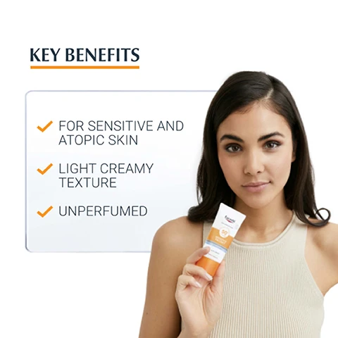 Image 1 - A young woman with dark hair holds a sunscreen tube while looking at the camera, with text nearby outlining key benefits that include for sensitive and atopic skin, light creamy texture, and unperfumed.
Image 2 - A hand holding a tube of Eucerin sunscreen with visible text indicating it is for sensitive skin, suitable for face and atopic skin, with a light creamy texture.
Image 3 - A graphic with an orange section displaying the text CLINICALLY PROVEN RESULTS and below it, VERY GOOD SKIN TOLERABILITY ON SENSITIVE SKIN, AND ECZEMA-PRONE SKIN.
Image 4 - An image featuring a creamy white texture with two labels highlighting key ingredients: Licocalcone A, described as neutralising free radicals, and Glycyrrhetinic Acid, noted for its DNA repair mechanism.
Image 5 - Image shows three Eucerin sun care products: a left bottle labeled Eucerin Sun Body Spray SPF 50, a middle tube labeled Eucerin Sun Body SPF 50 with Sensitive Protect, and a right tube labeled Eucerin After Sun Sensitive Relief, with the text DISCOVER MORE at the top.