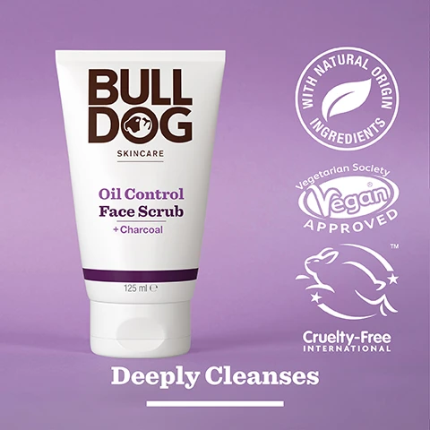 Image 2 - A tube of Bulldog Skincare Oil Control Face Scrub with charcoal is displayed against a purple background, featuring visible text that reads Bulldog Skincare, Oil Control Face Scrub + Charcoal, 125 ml, Deeply Cleanses, along with logos indicating it is made with natural origin ingredients, vegan approved, and cruelty-free.
Image 3 - An assortment of charcoal pieces scattered on a light background with the text 92% Natural Origin, Unlock the true potential of natural origin ingredients, Charcoal.
Image 4 - A person holds a white tube of Bull Dog Oil Control Face Scrub featuring a charcoal label, with text that reads For Oily Skin at the bottom.
Image 5 - A tube of Bulldog skincare oil control face scrub with charcoal is placed on a tiled surface, displaying text about its benefits and recycled materials including 125 ml volume and information about the tubes composition.
Image 6 - Three Bulldog skincare products for oil control are displayed on a bathroom counter, including Oil Control Face Wash, Oil Control Face Scrub, and Oil Control Moisturiser, with visible text reading Mattify & Balance Oil Prone Skin.