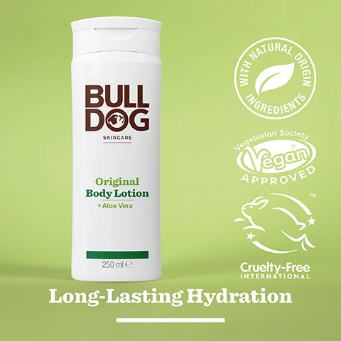 Image 2 - A white bottle of Bulldog skincare Original Body Lotion with a green label and aloe vera, set against a light green background, featuring icons for natural ingredients, vegetarian and vegan approval, and cruelty-free certification, with the text Long-Lasting Hydration.
Image 3 - A translucent green aloe vera leaf rests on a shiny surface, accompanied by text that reads 95% Natural Origin, Unlock the true potential of natural origin ingredients, Aloe Vera.
Image 4 - A white bottle of Bulldog Skincare Original Body Lotion with aloe vera sits against a light green background, featuring text that reads BULLDOG SKINCARE Original Body Lotion + Aloe Vera Long-Lasting Hydration 250 ml and All Day Hydration in bold.
Image 5 - A white bottle of Bulldog Original Body Lotion with aloe vera, labeled Normal To Dry Skin, is placed on a marble surface next to a gray towel and a pumice stone, indicating long-lasting hydration.