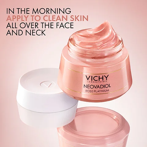 A pink jar of Vichy Neovadiol Rose Platinum cream sits slightly open with a white lid nearby, featuring text that says in the morning apply to clean skin all over the face and neck.
