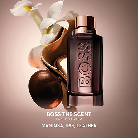 Image 2 - A brown perfume bottle labeled BOSS THE SCENT PARFUM FOR HIM is surrounded by a beige organic shape, a brown sphere, and white flowers, with the text MANINKA, IRIS, LEATHER below.
Image 3 - A glass perfume bottle labeled BOSS with a metallic cap is illuminated against a dark background, accompanied by a quote and five stars rating.
Image 4 - Image shows four bottles of Boss fragrances positioned on a reflective surface against a dark background, labeled with names Eau de Toilette, Magnetic Eau de Parfum, Parfum, and Elixir, with accompanying scent descriptions and intensity levels beneath each bottle.
Image 6 - An image of two perfume bottles labeled BOSS and THE SCENT PARFUM displayed on a reflective surface against a dark background.