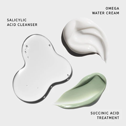 Image 1 - Three cosmetic products are displayed: a transparent liquid labeled Salicylic Acid Cleanser, a white cream labeled Omega Water Cream, and a green treatment labeled Succinic Acid Treatment, all positioned on a light gray background.
Image 2 - Image shows three skincare products arranged on a white background: a bottle labeled Salicylic Acid Cleanser, a tube labeled Succinic Acid Treatment, and a jar labeled Omega Water Cream, along with the text Clinically tested 3-step routine to visibly reduce blemishes and excess oil, and numbers indicating each step: 1 CLEANSE, 2 TREAT, 3 MOISTURIZE.
Image 3 - An image of a person holding a product package labeled THE INKEY LIST HYDROCOLLOID INVISIBLE PIMPLE PATCHES, which includes details about the products benefits, formulation, and clinical results, featuring visible text that states Includes 12X FREE Hydrocolloid Invisible Pimple Patches CLINICALLY PROVEN RESULTS IN 4 HOURS*.