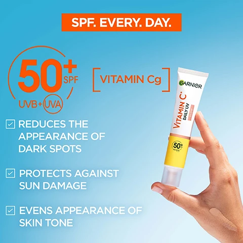 Image 1 - Hand holding a tube of Garnier sunscreen with a swatched sample on skin, featuring the text 50+ SPF UVB+UVA, VITAMIN Cg, REDUCES THE APPEARANCE OF DARK SPOTS, PROTECTS AGAINST SUN DAMAGE, EVENS APPEARANCE OF SKIN TONE, and SPF. EVERY. DAY. Image 2 - GLOWY SHEER TINT FOR EVEN, RADIANT & PROTECTED SKIN is demonstrated in a grid showing the product swatched and blended on four different skin tones. Image 3 - A bottle of Garnier Vitamin C Invisible UV Mist is displayed alongside text that reads HELP PROTECT FROM UV DAMAGES ANYTIME. ANYWHERE. PROVEN EFFICACY* IS QUICKLY ABSORBED 90% AGREE SKIN FEELS SMOOTHER 84% AGREE SKIN FEELS HYDRATED 88% AGREE *Self-assessment, 70 subjects. Image 4 - A woman with her eyes closed and head tilted back under a blue sky, with text reading ULTRA FINE MIST DIFFUSION TECHNOLOGY 50+ SPF UVB+UVA INSTANTLY PROTECTS FROM UV HELPS PREVENT DARK SPOTS.