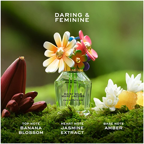 Image 1 - A Daisy Wild Marc Jacobs Eau So Intense perfume bottle with a multi-colored daisy cap sits on moss in a natural setting next to a banana blossom and white flowers, with text reading DARING & FEMININE, DAISY WILD MARC JACOBS EAU SO INTENSE, TOP NOTE BANANA BLOSSOM, HEART NOTE JASMINE EXTRACT, BASE NOTE AMBER. Image 2 - A person holds a large green Daisy Wild Marc Jacobs perfume bottle with a colorful flower lid, alongside the text DAISY WILD MARC JACOBS EAU SO INTENSE, five stars, and a review reading THIS PERFUME GIVES A FEELING OF SUMMER. ITS FLORAL AND FRUITY SCENT FEELS PERFECT FOR WHEN THE SUN IS SHINING. I WAS GIVEN SO MANY NICE COMPLIMENTS ABOUT THE FRAGRANCE WHEN WEARING IT. - CHELSEA, HOME TESTER CLUB. Image 3 - Two Daisy Wild Marc Jacobs perfume bottles are shown outdoors on wood with a grassy background DAISY WILD MARC JACOBS BOLD, FEMININE, & WILD VIBRANT, CAPTIVATING, & INTENSE DAISY WILD MARC JACOBS DAISY WILD MARC JACOBS EAU SO INTENSE.
