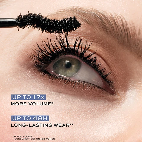 Image 1 - Close-up of an eye with mascara being applied to lashes, with text that reads UP TO 17x MORE VOLUME* UP TO 48H LONG-LASTING WEAR** *AFTER 2 COATS **CONSUMER TEST ON 108 WOMEN. Image 2 - A black mascara tube and wand covered in water droplets with text reading ACHIEVE EXTREME AND ULTRA-DRAMATIC VOLUME, WITH THE NEW WATERPROOF FORMULA and HYPNÔSE DRAMA WATERPROOF LANCOME. Image 3 - A Lancôme Hypnôse Drama Waterproof mascara tube and wand with a black stroke of mascara against a wet background with text Hypnôse Drama Waterproof and Sweat & Smudge Proof. Image 4 - Mascara brush and tube with water droplets on a dark background, with text OVERSIZED S-SHAPE CURVED BRUSH USE OUTSIDE CURVE TO DEFINE USE INSIDE CURVE TO LOAD VOLUME HYPNÔSE DRAMA WATERPROOF. Image 5 - Two black mascara tubes with wands, one tube is covered in water droplets, with text HYPNOSE DRAMA, LANCOME, HYPNOSE DRAMA WATERPROOF, NOW AVAILABLE IN WATERPROOF.
