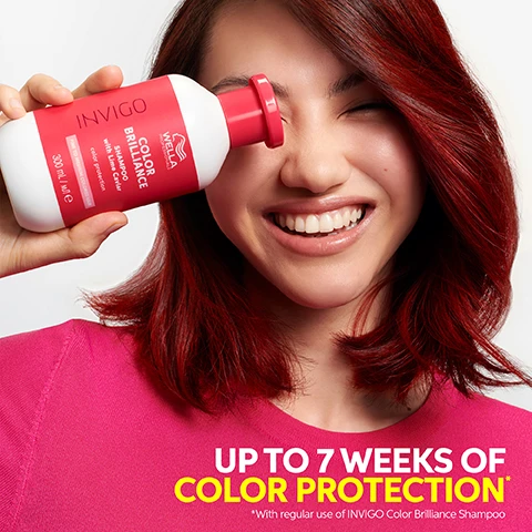 Image 1 - A person with vibrant red hair smiles broadly while holding a white and pink shampoo bottle to their face, with the bottle showing INVIGO WELLA PROFESSIONALS COLOR BRILLIANCE SHAMPOO with Lime Caviar color protection FINE TO MEDIUM COLORED HAIR 300 mL / ml e, and additional text on the image reads UP TO 7 WEEKS OF COLOR PROTECTION *With regular use of INVIGO Color Brilliance Shampoo. Image 2 - A hand pours white shampoo from a pink and white bottle into an open palm, with four white icons and corresponding text labels on a red background. The visible text reads: WELLA PROFESSIONALS INVIGO COLOR BRILLIANCE SHAMPOO with Lime Caviar color protection FINE TO MEDIUM COLORED HAIR 300 mL / M / E, COLOR PROTECTION, COLOR VIBRANCY, SHINE, METAL PURIFIER. Image 3 - The image shows a red tube of Wella Professionals Invigo Color Brilliance Conditioner with Lime Caviar, marked PROD:10/2022 and 200 ml / мл e, and specified for Fine to Medium Coloured Hair with a note about colour vibrancy, presented on a red background next to four white icons and their respective text labels: Color Vibrancy, Detangles, Shine, and Metal Purifier. Image 4 - Two hands interact with a red and white jar of Wella hair mask, one holding it from below and the others finger dipping into the white product, set against a red background, with four white icons above labeled Color Vibrancy, Smoothness, Shine, and Metal Purifier, and the jar displays Wella Professionals Invigo Color Brilliance Mask with Lime Caviar color vibrancy Fine to Medium Colored Hair 150 mL / 5.07 fl oz e. Image 5 - Three halves of finger limes, showing the citrus pearls inside, with additional small, pale yellow pearls scattered on a white surface, with text that reads LIME CAVIAR RICH IN POTENT ANTIOXIDANTS AND VITAMINS.