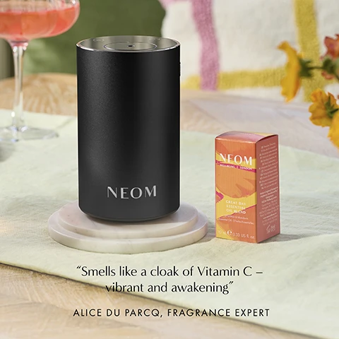 Image 1 - A black NEOM diffuser and orange NEOM essential oil box are shown on a table with the text NEOM LONDON GREAT DAY ESSENTIAL OIL BLEND e 10ml 0.33 US fl oz Smells like a cloak of Vitamin C – vibrant and awakening ALICE DU PARCQ FRAGRANCE EXPERT. Image 2 - A bottle of NEOM Great Day Essential Oil Blend Wild Mint & Mandarin and its box are shown on a yellow background with text reading UPLIFT YOUR DAY AND BOOST YOUR MOOD NEOM WELLBEING LONDON GREAT DAY ESSENTIAL OIL BLEND Wild Mint & Mandarin 10 ml 0.33 US fl. oz.