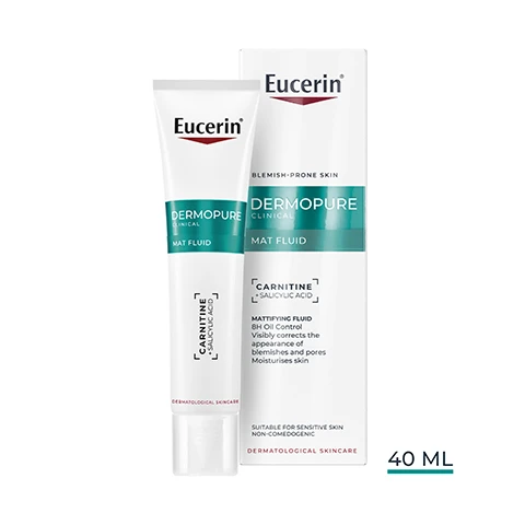 Image 1 - A white tube of Eucerin DermoPure Clinical Mat Fluid and its corresponding box are displayed, with visible text including Eucerin, DermoPure Clinical, Mat Fluid, Carnitine Salicylic Acid, Dermatological Skincare, Blemish-Prone Skin, Mattifying Fluid BH Oil Control Visibly corrects the appearance of blemishes and pores Moisturises skin, Suitable for Sensitive Skin, Non-Comedogenic, and 40 ML. Image 10 - The image displays a three-step skincare regimen featuring a green pump bottle cleanser, a white tube fluid, and an orange bottle sunscreen, with visible text Eucerin, 1 Purifying Cleanser, 2 Mat Fluid, 3 Oil Control SPF 50+. Image 2 - A hand squeezes a white Eucerin Dermopure Clinical Mat Fluid tube, showing a small yellow drop of product on a finger, with the text Eucerin, DERMOPURE CLINICAL, MAT FLUID, CARNITINE, SALICYLIC ACID, DERMATOLOGICAL SKIN, MATTIFYING FINISH, NON-COMEDOGENIC, SUITABLE ON SENSITIVE SKIN. Image 3 - A woman applies Eucerin Dermopure Oil Control Mattifying Fluid with L-Carnitine from a white tube to her cheek, showing three dots of cream on her skin, with the image also displaying the Eucerin logo, text reading Mattifying Fluid 8-HOUR OIL CONTROL¹, and a footnote stating ¹ Clinical study, 38 subjects, self-assessment 8 hours after initial product application. Image 4 - A smiling person with curly hair holds a white and green tube of Eucerin DermoPURIFYER product, with visible text reading Eucerin, CORRECTS BLEMISHES AND PORES + HYDRATES. Image 5 - Three white tubes of Eucerin DermoPure Clinical Mat Fluid are displayed with text reading Eucerin DERMOPURE CLINICAL MAT FLUID CARNITINE + SALICYLIC ACID DERMATOLOGICAL SKINCARE, alongside large text that says 8-HOUR OIL CONTROL¹ and a small note at the bottom stating ¹ Clinical study, 38 subjects, self-assessment 8 hours after initial product application. Image 6 - A comparison image shows a blurred white pump bottle and a clear white tube of Eucerin Dermopure skincare products, with the visible text NEW LOOK SAME FORMULA, Eucerin, OLD, NEW, Dermopure Clinical Mat Fluid, Carnitine Salicylic Acid, Dermatological Skincare. Image 7 - A person in a white lab coat holds a tube of Eucerin DermoPure Mat Fluid, with text reading Eucerin, RECOMMENDED BY DERMATOLOGISTS, FOR OILY TO BLEMISH-PRONE SKIN. Image 8 - The image displays an abstract background of light blue transparent spheres, resembling water droplets or gel beads, with the Eucerin logo in the top right, and text below it stating With skin-regulating CARNITINE Sebum-Controlling amino-acid Regulates the production of sebum Reduces the amount of sebum Balances oily skin. Image 9 - The image features abstract visuals for skincare ingredients: a teal wavy liquid for Salicylic Acid, and clear and blue spheres for Carnitine, along with the text Eucerin, Salicylic Acid To exfoliate and unclog blocked pores, Carnitine To regulate the production of sebum.