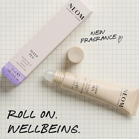 Image 1 - A light pink Neom Sleep Pen box is shown next to an open Neom Sleep Pen rollerball and its cap on a grid paper background, featuring the text NEOM WELLBEING | LONDON SLEEP PEN Lavender, Patchouli & Geranium Rollerball Applicateur à Bille 12 mL e 0.40 US fl. oz. NEW FRAGRANCE ROLL ON. WELLBEING. Image 2 - A light-colored Neom Sleep Pen rollerball tube with its cap off is shown alongside its packaging box, displaying text including NEOM WELLBEING | LONDON, SLEEP PEN Lavender, Patchouli & Geranium, 12 mL e 0.40 US fl. oz., and a prominent claim that 89% SAID IT HELPED PREPARE FOR THE PERFECT NIGHTS SLEEP* *Independent blind consumer study of 66 people, after initial use over 2 weeks. Image 3 - A hand applies a beige NEOM Sleep Pen to a persons neck against a purple background, with visible text reading 100% natural fragrances. Lavender, Patchouli, Geranium. Roll onto pulse points to help prepare for sleep. Instantly calming and allows me to totally relax*. The product itself shows NEOM WELLBEING | LONDON, SLEEP PEN, Lavender, Patchouli & Geranium Rollerball - Applicateur à Bille, 12 mL e 0.40 US fl. oz. and a footnote states *Independent blind consumer study of 66 people, over 2 weeks.