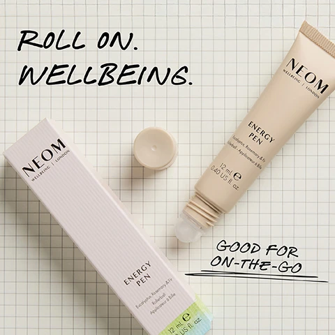 Image 1 - Two Neom Energy Pen products, one in its light pink box and another uncapped showing the rollerball, are displayed on a grid paper background with overlaid text that reads Roll on. Wellbeing., Good for on-the-go, Neom Wellbeing London, Energy Pen, Eucalyptus, Rosemary & Fir, Rollerball - Applicateur a Bille, 12 mL e 0.40 US fl. oz. Image 2 - A cream-colored NEOM Wellbeing London Energy Pen roll-on with its cap removed is shown on a light background, alongside text that states 93% SAID IT IS THE PERFECT POCKET-SIZED ENERGY BOOST*, and the product itself reads ENERGY PEN, Eucalyptus, Rosemary & Fir, Rollerball - Applicateur à Bille, 12 mL e 0.40 US fl. oz., with a footnote stating *Independent blind consumer study of 67 people over 2 weeks. Image 3 - A hand applies a beige roll-on product to the inner wrist of another persons hand, set against a solid light green background, with visible text that reads: 100% natural fragrances. Eucalyptus, Rosemary, Fir. Roll onto pulse points whenever you need a boost of energy. The product is energetic. Helping me focus. * NEOM WELLBEING | LONDON ENERGY PEN Eucalyptus, Rosemary & Fir Roller-ball - Applicateur à Bille 12 ml e 0.40 US fl. oz. *Independent blind consumer study of 67 people over 2 weeks.