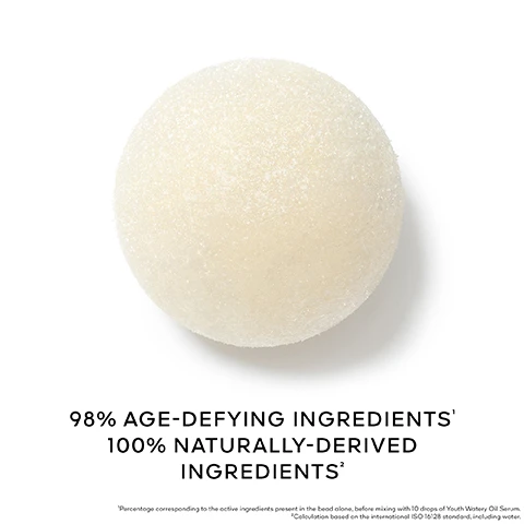 Image 1 - A single, textured, off-white spherical bead is shown on a white background, accompanied by the text: 98% AGE-DEFYING INGREDIENTS¹ 100% NATURALLY-DERIVED INGREDIENTS² ¹Percentage corresponding to the active ingredients present in the bead alone, before mixing with 10 drops of Youth Watery Oil Serum. ²Calculation based on the international ISO 16128 standard, including water. Image 2 - A tall glass bottle of golden liquid serum with a dropper dispensing a drop stands next to a small brown vial containing dark beads on a white platform against a blue background, with text that reads 7-DAY YOUTH TREATMENT 98% AGE-DEFYING INGREDIENTS¹ ACTIVATED BY THE YOUTH WATERY OIL SERUM, ABEILLE ROYALE SERUM HUILE-EN-EAU JEUNESSE YOUTH WATERY OIL SERUM GUERLAIN PARIS, and ¹Percentage corresponding to the active ingredients present in the bead alone, before mixing with 10 drops of Youth Watery Oil Serum. Image 3 - A hand is shown catching a single light yellow product sphere, while a clear glass dropper filled with gold beads drips liquid onto it, with visible text that reads Melt a sphere with 10 drops of Youth Watery Oil Serum. Apply immediately after mixing to face and neck. Image 4 - A split image shows a womans face and neck, with the left side depicting visible wrinkles Before and the right side showing reduced wrinkles After 30 Minutes, accompanied by a hexagonal close-up of the neck skin on both sides, with additional text stating UNRETOUCHED SKIN SHOT UNDER SUPERVISION OF A BAILIFF RESULTS MAY VARY FROM ONE INDIVIDUAL TO ANOTHER. Image 5 - A before and after comparison image shows a close-up of a persons dark skin on their face and neck, with the left side labeled BEFORE displaying textured skin and a hexagonal inset highlighting bumps, and the right side labeled AFTER 30 MINUTES showing noticeably smoother skin and a hexagonal inset displaying the improved texture, alongside the visible text UNRETOUCHED SKIN SHOT UNDER SUPERVISION OF A BAILIFF RESULTS MAY VARY FROM ONE INDIVIDUAL TO ANOTHER. Image 6 - A woman with radiant skin holds two Abeille Royale serum bottles, one dark and one golden, near her face, with text in the image reading Visible Youthfulness From The First Dose Radiance & Wrinkle Correction. Image 7 - A woman with radiant skin holds a small, dark amber and gold Guerlain Abeille Royale cosmetic product, and accompanying text states After 7 Days, Skin is Visibly Transformed for 99% of Women 1, and 1 Use test, 104 women. Image 8 - A hexagonal gold-rimmed dish contains viscous golden liquid with a glass dropper stirring it, accompanied by the text Black Bee Honey & Vitamin CG.