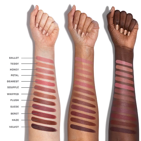 Image 1 - Three forearms with fair, medium, and deep skin tones display twelve vertical lipstick swatches, labeled BALLET, TEDDY, HONEY, PETAL, DEAREST, SOUFFLÉ, WHIPPED, PLUSH, SUEDE, BERET, HAZE, and VELVET. Image 2 - A close-up of a matte lipstick in a rose gold tube with an M engraved on the tip, next to the text YOUR MUST-HAVE MATTE Glides on weightlessly with a comfortable, silky smooth feel. YOUR FAVORITE FILTER Buildable, true-to-lip shades in warm and cool undertones. YOUR CUSTOM COMBO Pair with our Signature Lip Pencil for personalized effects. Image 3 - The image displays a comparison chart of two lip products, a lipstick and a liquid lip mousse, detailing their features in a table. PICK YOUR PRODUCT LIP FILTER HYDROPLUMP SOFT MATTE LIPSTICK SOULMATTE VELVET LIP MOUSSE COVERAGE Buildable Single swipe color FINISH Soft matte (never flat) Velvety smooth matte finish INGREDIENTS Infused with a plumping peptide, jojoba seed oil & mango butter Infused with Vitamin E SHADES 12 shades 10 shades Image 4 - Three Morphe lip products are displayed against a white background with their coordinating swatches, under the title BUILD YOUR LIP ROUTINE: a peachy-brown lip pencil labeled MORPHE with the text SIGNATURE LIP PENCIL below it; a peachy-brown lipstick in a matte tube labeled MORPHE with the text LIP FILTER HYDROPLUMP SOFT MATTE LIPSTICK below it; and a shimmery peachy-brown lip gloss in a clear tube labeled MORPHE DRIPGLASS GLAZED with the text DRIPGLASS GLAZED HIGH SHINE LIP GLOSS below it.