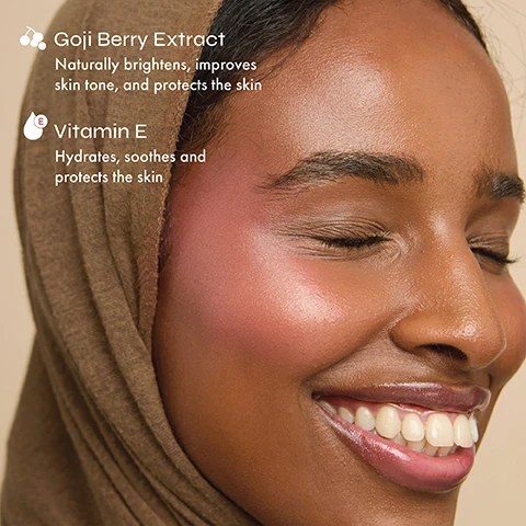Image 3 - A smiling person with dark skin, wearing a brown head covering and rosy blush on their cheeks, is shown with overlaying text that reads Goji Berry Extract Naturally brightens, improves skin tone, and protects the skin Vitamin E Hydrates, soothes and protects the skin. Image 4 - A flat lay image shows several square blush compacts in various shades of pink and coral, some open to reveal applicators, with the brand logo The Beauty Crop visible on closed compacts, and text overlays stating Ultra pigmented, Long-lasting matte finish, and Blends seamlessly without caking or creasing. Image 5 - Twelve open square compacts of shimmering makeup in various shades from light pink to bronze are arranged in rows on a light background, with text that reads Long-lasting luminous finish, Ultra pigmented, and Velvety-soft formula that melts into skin.