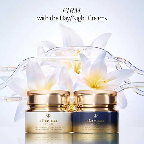 Image 2 - Two luxury cream jars, one light and one dark, with gold caps, sit reflected on a surface among white flowers and clear tubes with golden beads, with the text FIRM, with the Day/Night Creams above; the left jar reads Clé de Peau Beauté CRÈME JOUR PROTECTRICE RENFORCÉE ADVANCED PROTECTIVE DAY CREAM and the right jar reads Clé de Peau Beauté CRÈME NUIT INTENSIVE RENFORCÉE ADVANCED INTENSIVE NIGHT CREAM. Image 3 - A luxurious gold-lidded jar with a blue-to-gold gradient body, featuring the Clé de Peau Beauté logo, sits on a swirl of pink cream against a light pink background, with the text Clé de Peau BEAUTÉ CRÈME NUIT INTENSIVE RENFORCÉE ADVANCED INTENSIVE NIGHT CREAM, and a promotional message reading In 4 weeks, skin is visibly smoother for 100% with reduced wrinkles for 99% *Consumer test on 108 women. Image 4 - An infographic with a light blue background features three circular images of plant extracts and their benefits: white bitter orange flowers with text BITTER ORANGE FLOWER EXTRACT TO SUPPORT THE SKIN’S 24-HOUR CIRCADIAN RHYTHM*, white lily flowers in a glass with text RADIANT LILY EXTRACT TO ACT ON SKIN DEFENSE, and a split image of pink cherry blossoms and green silk tree branches with text SILK TREE & CHERRY BLOSSOM HELPS PROMOTE PRODUCTION OF SKIN COMPONENT.*, with a small note *In-vitro test at the bottom right. Image 5 - Four Clé de Peau Beauté skincare products are arranged on a reflective surface against a soft white background with white flowers and clear tubes containing liquid droplets, including a shimmering iridescent bottle of clé de peau BEAUTÉ LE SÉRUM THE SERUM, a tall gold-toned bottle of clé de peau BEAUTÉ LOTION ESSENTIELLE HYDRO-ADOUCISSANTE HYDRO-SOFTENING ESSENCE LOTION, a white and gold jar of clé de peau BEAUTÉ CRÈME JOUR PROTECTRICE RENFORCÉE ADVANCED PROTECTIVE DAY CREAM, and a blue and gold jar of clé de peau BEAUTÉ CRÈME NUIT INTENSIVE RENFORCÉE ADVANCED INTENSIVE NIGHT CREAM.