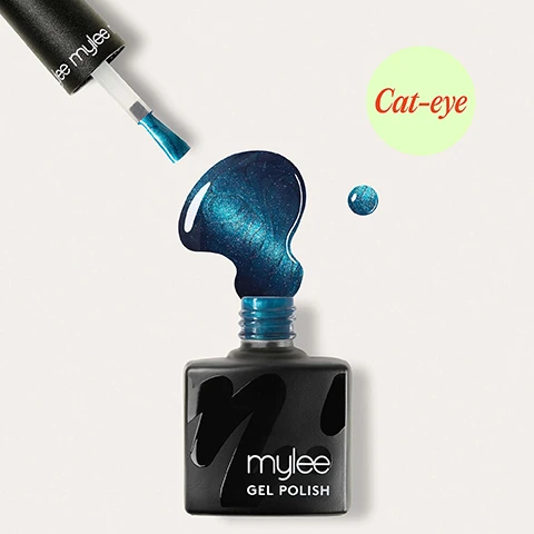 Image 1 - A black Mylee gel polish bottle with an open brush showing shimmering blue cat-eye effect polish, a large spill, and a small drop, displays the text lee mylee, mylee GEL POLISH, and Cat-eye. Image 2 - A persons hands are shown with nails painted a shimmering dark teal color, with white text overlaid saying Chip-free for up to 3 weeks. Image 3 - A close-up of a hand with shimmering blue nail polish touching a persons face, with a blurred blue object in the background and a visible green eye on the right, displaying text that reads Cures in 60 seconds. Image 4 - A hand with all fingernails painted a shimmery teal blue, with text that reads Removes in 10 minutes. Image 5 - A young woman with blue metallic nail polish and blue headphones sits on colorful chairs by a sunny window, with the text Applies like a normal polish visible on the bottom left. Image 6 - A black Mylee gel polish bottle with a red cap and applicator brush, from which red nail polish is dripping, is shown with a circular infographic detailing the product features: LASTS UP TO 3 WEEKS, CURES IN 30-60 SECONDS, HEMA - FREE, NO DRY TIME – CURES UNDER LED LAMP, REMOVES IN 10 MINUTES, APPLIES LIKE NORMAL POLISH, VEGAN. Image 7 - Image showing a four-step gel manicure guide with illustrations and text instructions. Step by step 01 Prep File to shape and use a Buffing Block to remove shine from the nail plate. Wipe your nails with a dash of 2-IN-1 Prep & Wipe to remove any oils. 02 Base Apply a Base Coat and cure nails for 60 seconds using an LED Lamp. For bold results, then apply a black Gel Polish – or experiment with other shades like purples and pinks for a twist, before curing. 03 Colour Apply a layer of Cat-Eye Gel Polish. Do not cure just yet. Hold a magnet close to the nail for 10-15 seconds to create your desired effect, then cure for 60 seconds (LED) or 120 seconds (UV). 04 Finish To finish, apply a layer of Top Coat and cure for 60 seconds. Wash your hands, then apply Mylee’s Nail & Cuticle Oil on the nails and cuticles to keep them nourished and hydrated.
