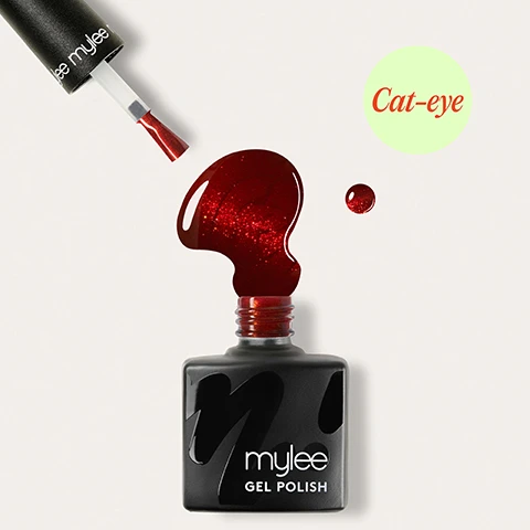 Image 1 - A black bottle of Mylee gel polish with glittery red nail polish spilling from its top, a matching brush floating above, and a small drop of polish to the right, with a green circle in the top right containing the text Cat-eye. Image 2 - A woman with red manicured nails and glasses rests her hands on her face and chest, wearing a denim shirt, with the text Chip-free for up to 3 weeks overlayed. Image 3 - Two hands with shiny red glitter nail polish are shown, one resting gently on the other, against a blue denim garment, with the visible text Cures in 60 seconds. Image 4 - A close-up shows a persons hands with shimmery red nail polish near their face, which features pink lips, tortoise-shell glasses, and a gold hoop earring, with the text Removes in 10 minutes. Image 5 - A woman wearing tortoiseshell glasses and dark red nail polish looks directly at the camera, her hands resting near her face, with a blurred bookshelf in the background, and text reads Applies like a normal polish. Image 6 - A black Mylee Gel nail polish bottle with a red cap, the applicator brush elevated with a thick drip of red polish falling from it, illustrating product benefits around a circular flow diagram that states: VEGAN, LASTS UP TO 3 WEEKS, CURES IN 30-60 SECONDS, HEMA - FREE, NO DRY TIME – CURES UNDER LED LAMP, REMOVES IN 10 MINUTES, APPLIES LIKE NORMAL POLISH. Image 7 - The image illustrates a four-step guide for gel nail polish application, visually showing Step 1 Prep where a nail is buffed, Step 2 Base with base coat application and an LED lamp, Step 3 Colour with orange polish, a magnet, and an LED lamp, and Step 4 Finish with cuticle oil being applied to a polished nail, accompanied by the full instructional text: Step by step 01 Prep File to shape and use a Buffing Block labeled mylee to remove shine from the nail plate. Wipe your nails with a dash of 2-IN-1 Prep & Wipe to remove any oils. 02 Base Apply a Base Coat and cure nails for 60 seconds using an LED Lamp labeled m. For bold results, then apply a black Gel Polish – or experiment with other shades like purples and pinks for a twist, before curing. 03 Colour Apply a layer of Cat-Eye Gel Polish. Do not cure just yet. Hold a magnet close to the nail for 10-15 seconds to create your desired effect, then cure for 60 seconds (LED) or 120 seconds (UV). 04 Finish To finish, apply a layer of Top Coat and cure for 60 seconds. Wash your hands, then apply Mylees Nail & Cuticle Oil on the nails and cuticles to keep them nourished and hydrated.