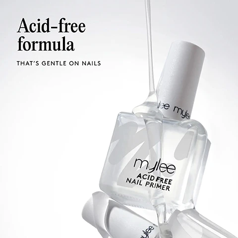 Image 1 - A clear Mylee Acid Free Nail Primer bottle has clear liquid pouring from its brush onto another clear bottle, with a white cap visible, against a white background, featuring the text Acid-free formula THATS GENTLE ON NAILS and Mylee ACID FREE NAIL PRIMER. Image 2 - A clear bottle of Mylee Acid Free Nail Primer is surrounded by a clear liquid on a white background, with text reading BOOSTS ADHESION To prevent lifting and chipping. Image 3 - Two Mylee nail polish bottles, a black gel polish and a clear acid-free nail primer, are tilted towards each other and connected by a stretchy, clear substance, with the text Creates a strong bond For longer-lasting gel manis. Image 4 - An illustration shows a hand with five stacked, translucent layers on a fingernail, representing the application process, alongside a numbered list that reads: Application by order, 05 TOP COAT, 04 GEL NAIL POLISH, 03 BASE GEL, 02 ACID-FREE PRIMER, 01 NAIL PREP DEHYDRATOR. Image 5 - The image shows four close-up sections of nail polish brushes in liquids, labeled top to bottom: a brush in red liquid for GEL, a brush in clear liquid for BASE, a brush in clear liquid for PRIMER, and a brush in clear liquid for DEHYDRATOR. Image 6 - A hand applies mylee mylee clear nail polish to a bare fingernail, surrounded by text that lists product benefits: MINIMISES DAMAGE AND IRRITATION TO NATURAL NAILS, GENTLE FORMULA; ACID -FREE, STRONG, SECURE BOND BETWEEN THE NATURAL NAIL AND GEL POLISH, SMOOTHS OUT RIDGES, VEGAN, CRUELTY-FREE, HEMA-FREE, PROFESSIONAL RESULTS; HELPS PREVENT LIFTING, AND CHIPPING. Image 7 - The image illustrates a four-step nail preparation process with line art: Step 1 shows a cuticle being pushed back, Step 2 shows a Mylee bottle and wipe for cleaning a nail, Step 3 shows a brush applying liquid to a nail for dehydration, and Step 4 shows a brush applying primer to a nail with a Mylee bottle nearby. The text reads: Step by step. 01 Prep: Push back your cuticles using a Mylee Metal Cuticle Pusher or Wooden Cuticle Pusher Stick, then lightly buff your nails using the Mylee Buffing Block or 240 Grit Nail File. 02 Cleanse: Wipe your nails with a dash of Mylee 2-in-1 Nail Prep & Wipe on a Mylee Lint Free Wipe to remove any oils. 03 Dehydrate: Brush the Mylee Nail Prep Dehydrator over the entire nail plate and allow it to air dry. 04 Prime: Apply a thin layer of Mylee Acid-Free Nail Primer to the edges of the nail. Let it air dry for 30 secs - it should feel slightly tacky. Then start your mani with a Mylee Base Coat! Product sold separately.